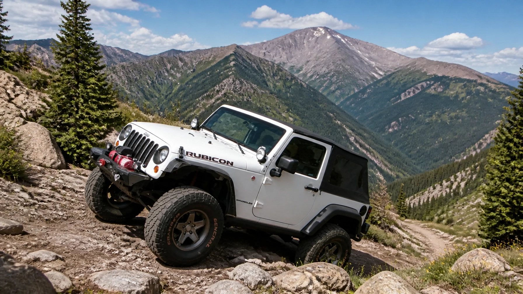 A white Jeep Wrangler Rubicon navigating a rocky mountain trail in Colorado Springs with Pikes Peak in the background.