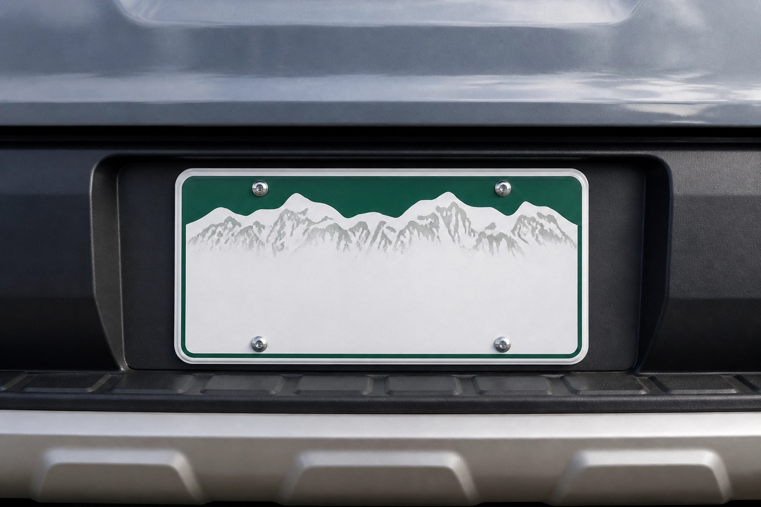 Close-up of a Colorado license plate with green mountain design
