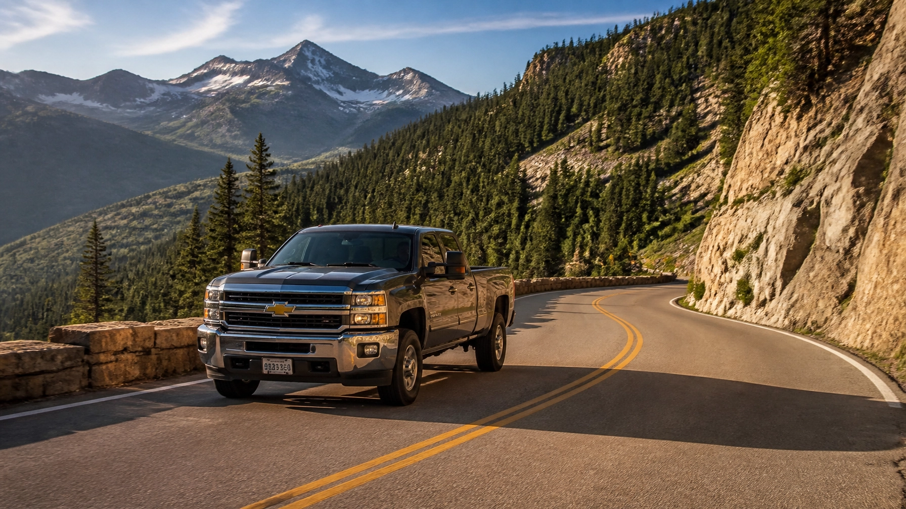 Used truck driving on a winding Colorado mountain highway