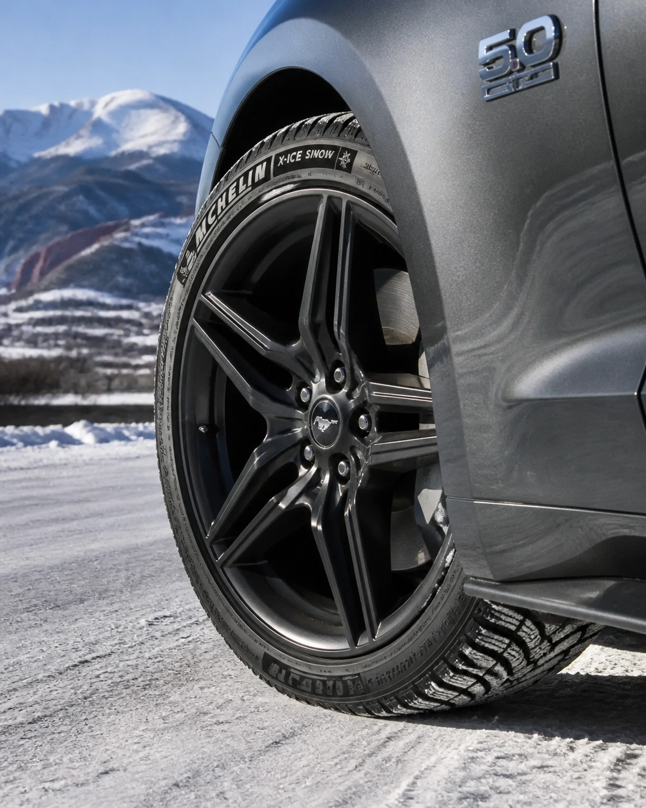 Performance winter tires on a Ford Mustang at McCloskey Truck Town in Colorado Springs CO