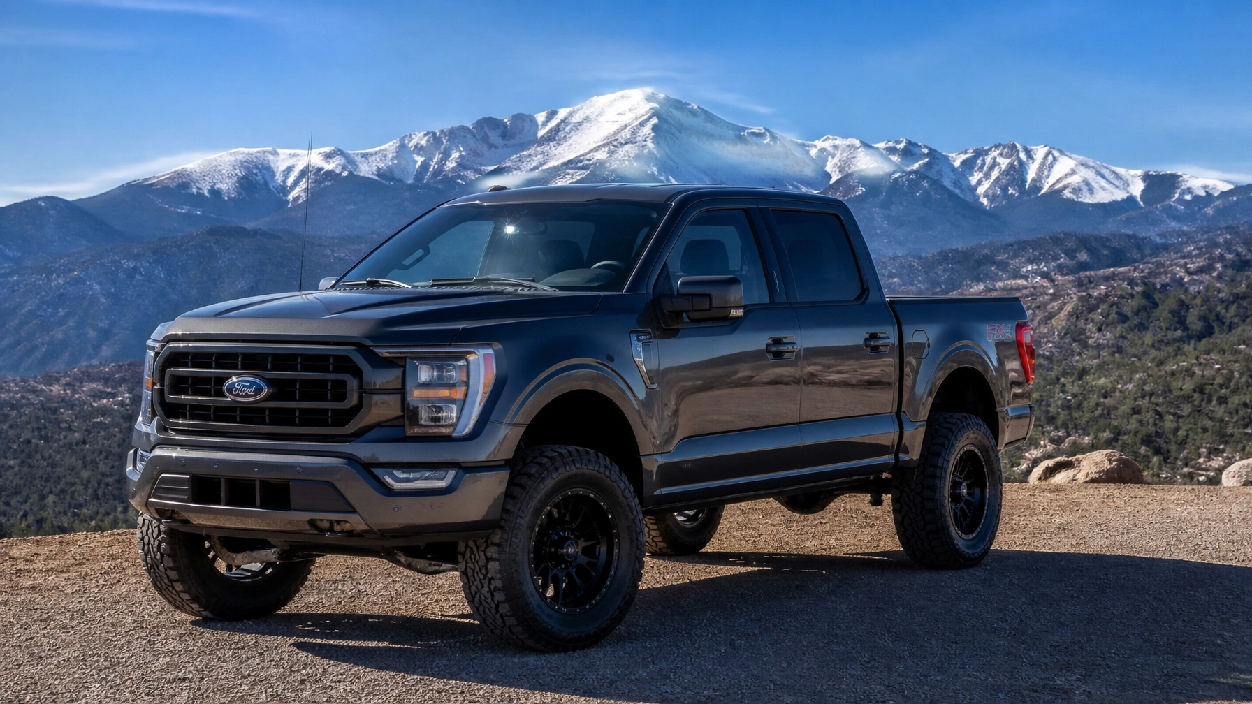 2022 Ford F-150 Lariat with a 4-inch lift kit and 35-inch all-terrain tires at McCloskey Truck Town in Colorado Springs CO