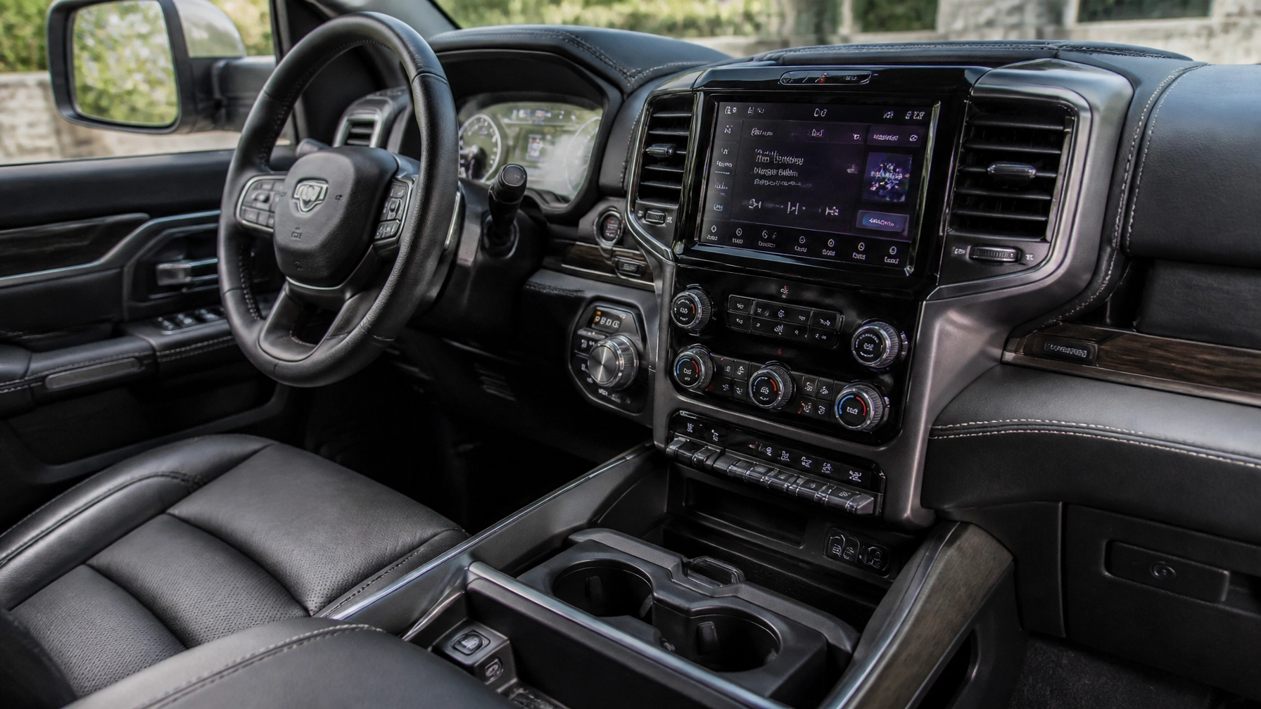 Modern truck interior featuring a large infotainment screen and premium leather seating at McCloskey Truck Town in Colorado Springs CO