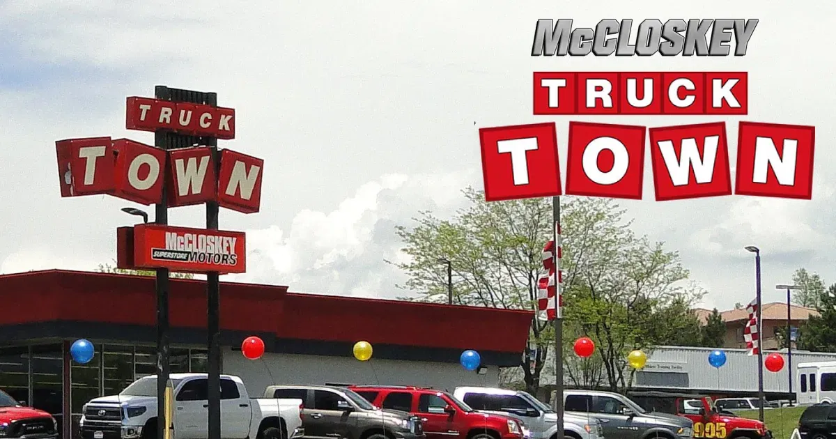The McCloskey Truck Town dealership exterior featuring the iconic red and white sign in Colorado Springs CO