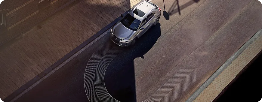 Lexus UX cornering on a winding road