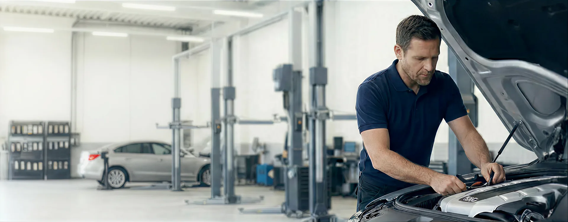 Certified technician servicing a European vehicle at the Merit Auto Group service center