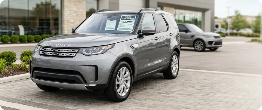Row of used Land Rover vehicles in a dealership lot