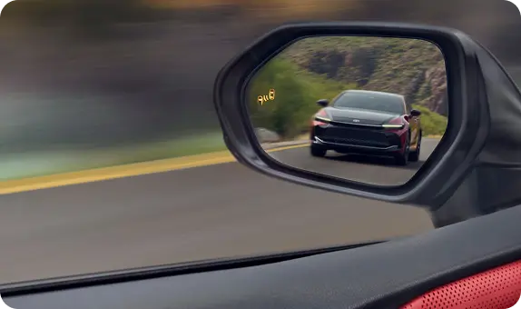 Toyota Camry blind spot monitor alert on the side mirror