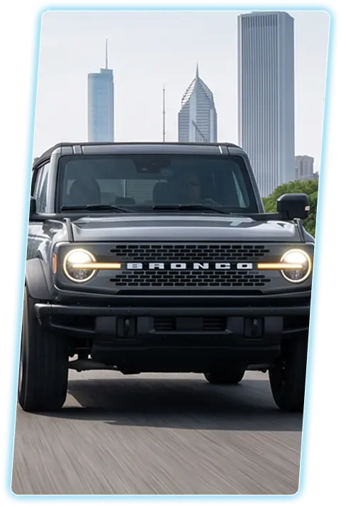 Ford Bronco front view against a city skyline