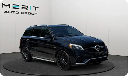 Black Mercedes-Benz AMG GLE SUV on a studio turntable, front three-quarter view
