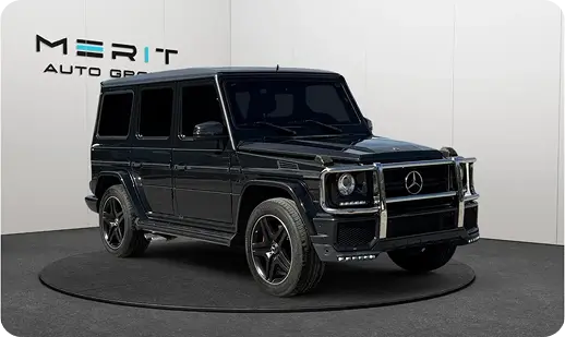 Black Mercedes-Benz G-Class SUV on a studio turntable, front three-quarter view