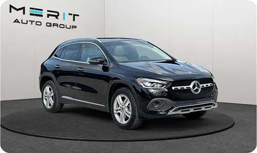 Black Mercedes-Benz GLA compact SUV on a studio turntable, front three-quarter view