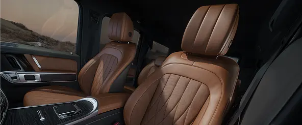 Brown leather front seats inside a Mercedes-Benz G-Class