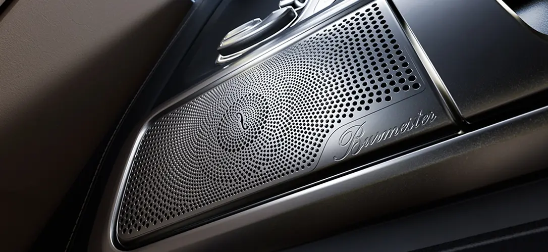 Close-up of a Burmester premium speaker grille in a Mercedes-Benz cabin