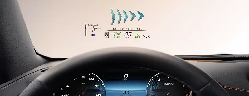 Mercedes-Benz head-up display projecting navigation arrows onto the windshield above the gauge cluster