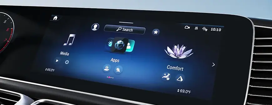 Mercedes-Benz MBUX infotainment touchscreen showing media, apps and comfort controls