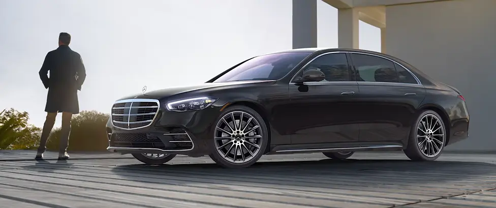 Black Mercedes-Benz S-Class flagship sedan, front three-quarter view