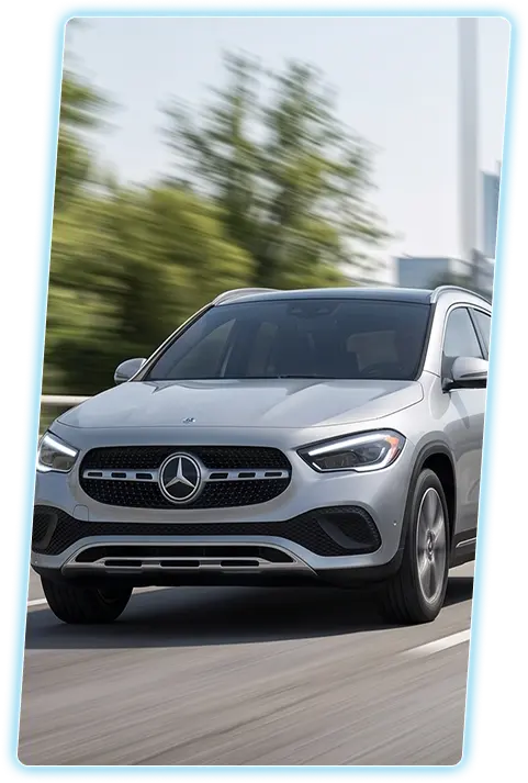 Silver Mercedes-Benz GLA front view against a city skyline