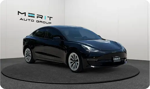 Tesla sedan on a studio turntable
