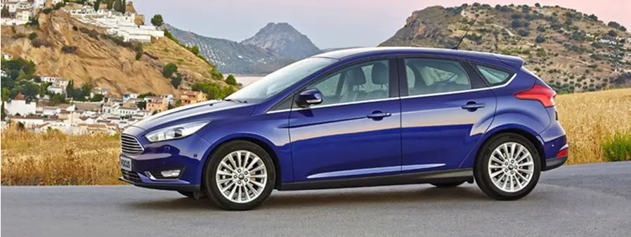 Ford Focus at a fuel pump highlighting its efficiency