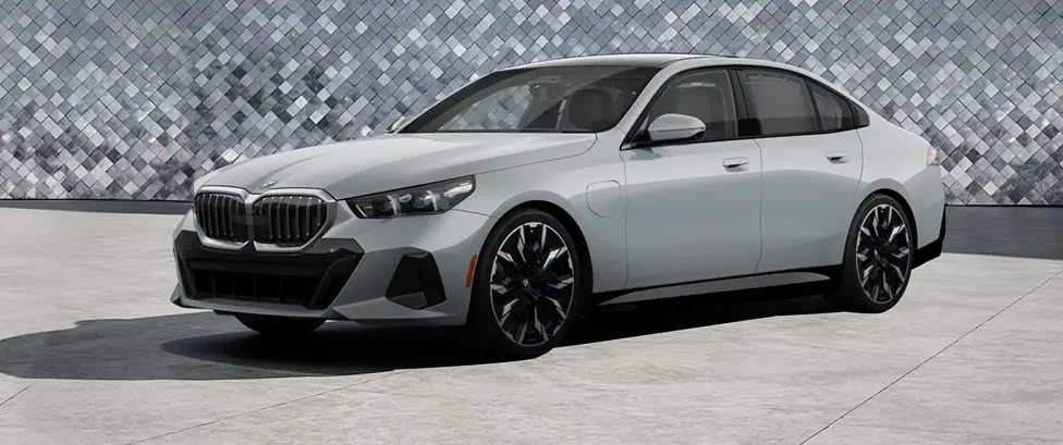 BMW 5 Series sedan on the road