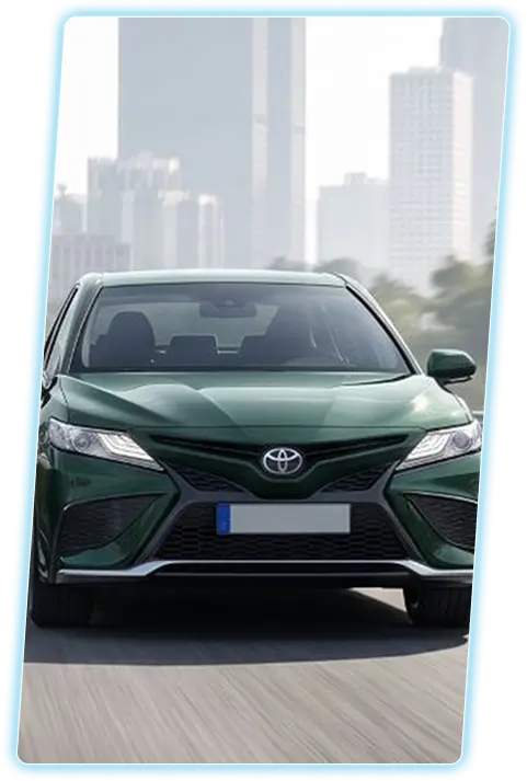 Toyota sedan front view against a city skyline