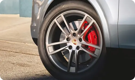Close-up of a Porsche Cayenne alloy wheel with a red brake caliper