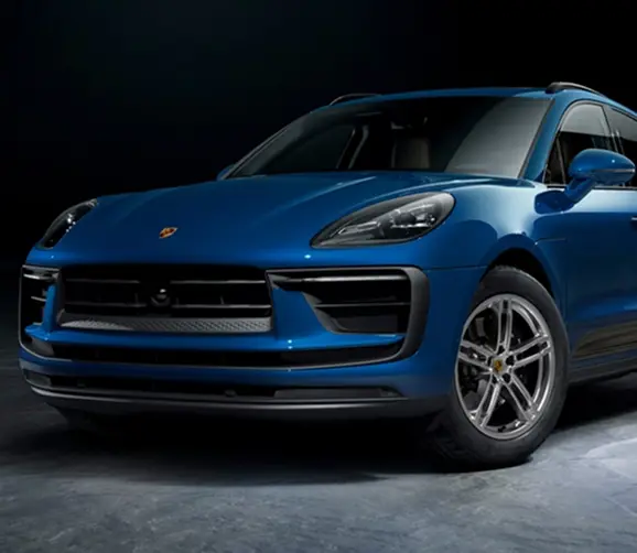 Blue Porsche Macan front three-quarter view