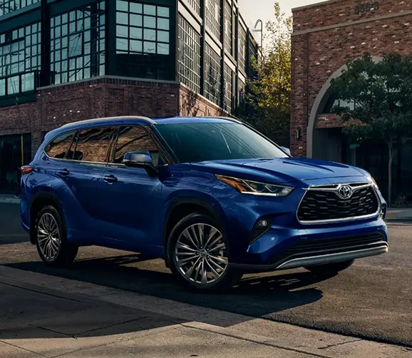 Blue Toyota Highlander front three-quarter view