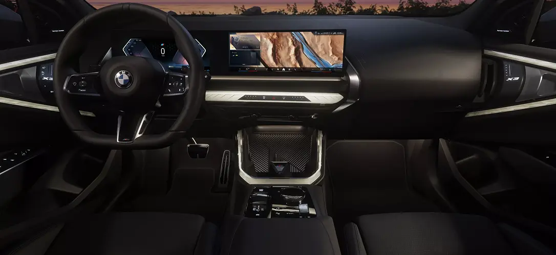 BMW X3 interior dashboard with a curved widescreen display