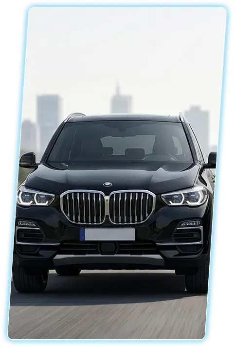 Black BMW X5 front view against a city skyline