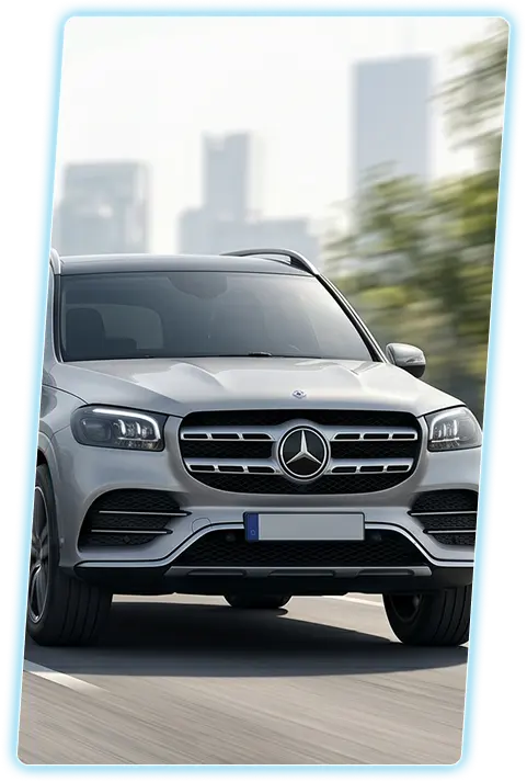 Silver Mercedes-Benz GLS front view against a city skyline