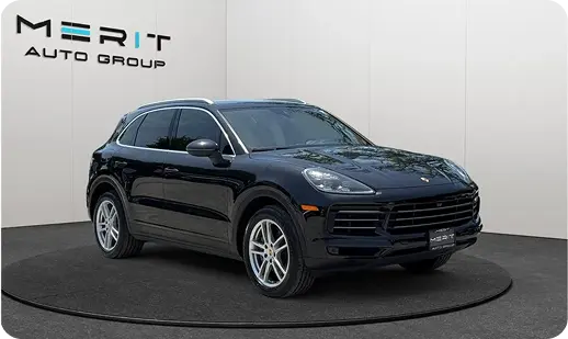 Black Porsche Cayenne SUV on a studio turntable