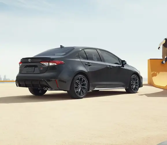 Gray Toyota Corolla, rear three-quarter view