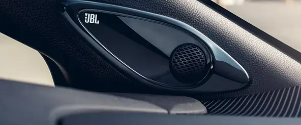 Close-up of a JBL speaker in the Toyota Corolla cabin