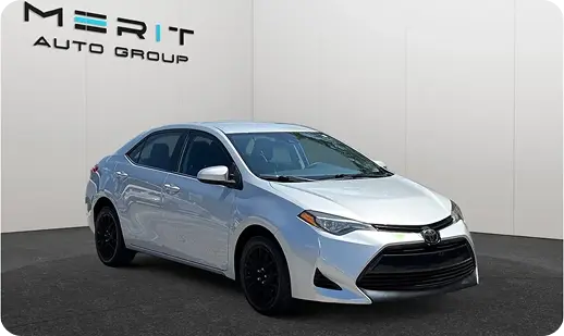 Silver Toyota Corolla sedan on a studio turntable, front three-quarter view