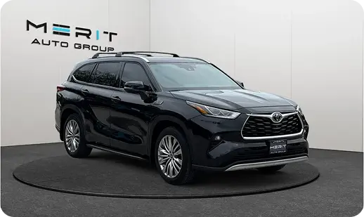 Black Toyota Highlander SUV on a studio turntable, front three-quarter view