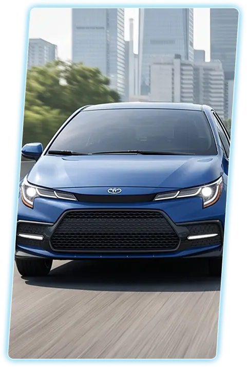 Blue Toyota Corolla front view against a city skyline