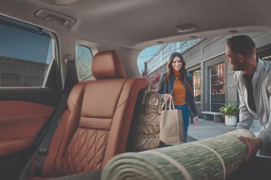 People loading up Nissan Rogue