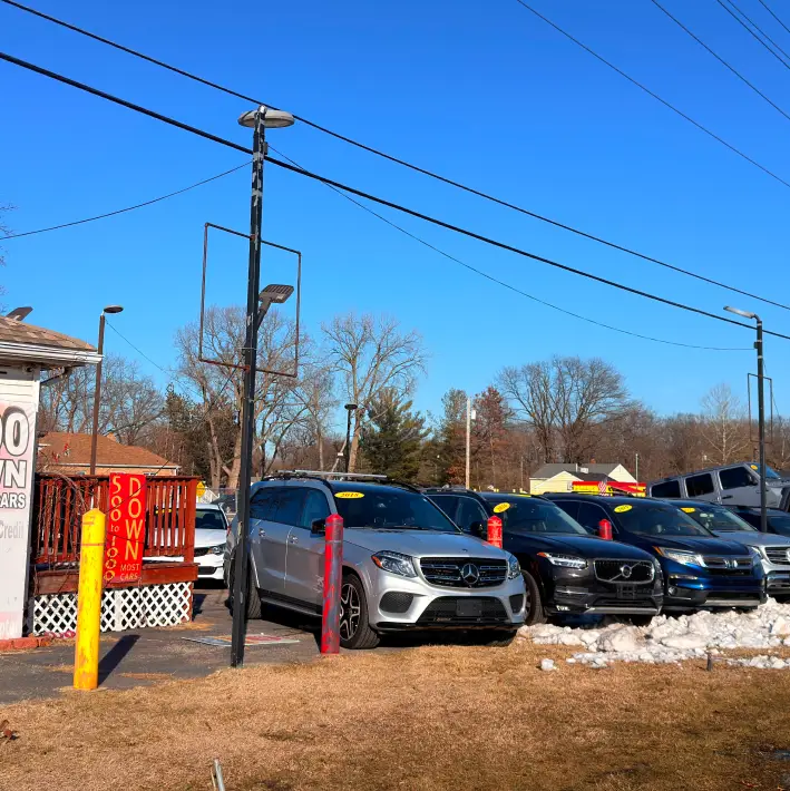 Used vehicles displayed outside Northwest Indiana Auto Outlet dealership lot.