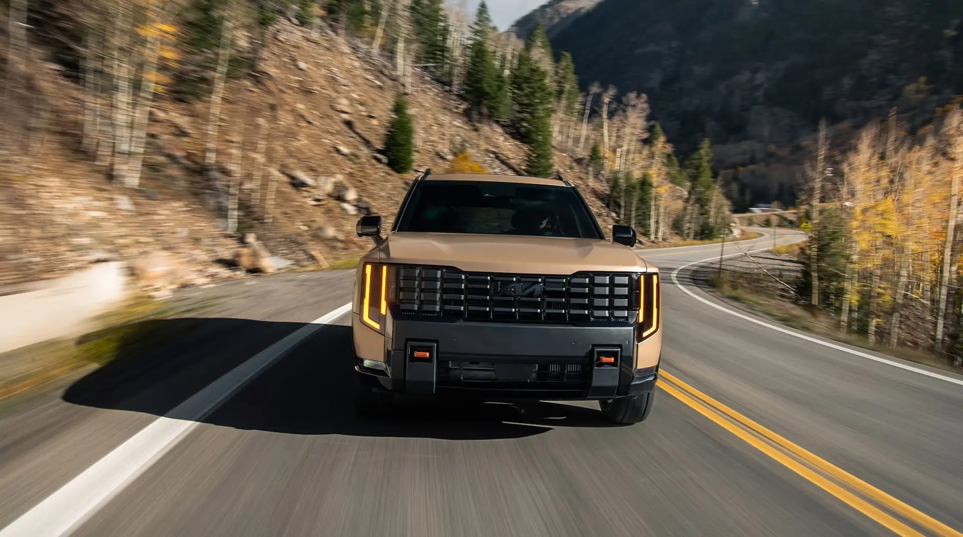 2027 Kia Telluride head-on view driving on a mountain road