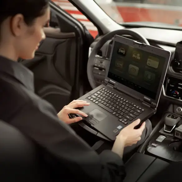 Service technician inside a Nissan vehicle