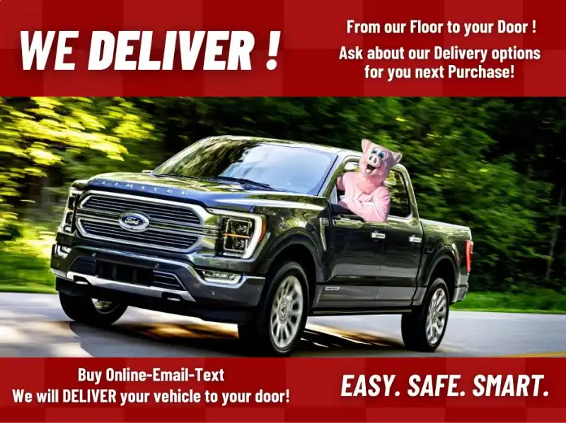 Truck on the road with Pigg Enterprises' pig mascot, promoting vehicle delivery