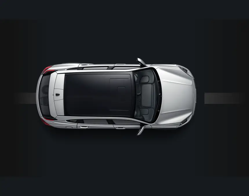 Silver vehicle parked on a dark background at Auto Trendz
