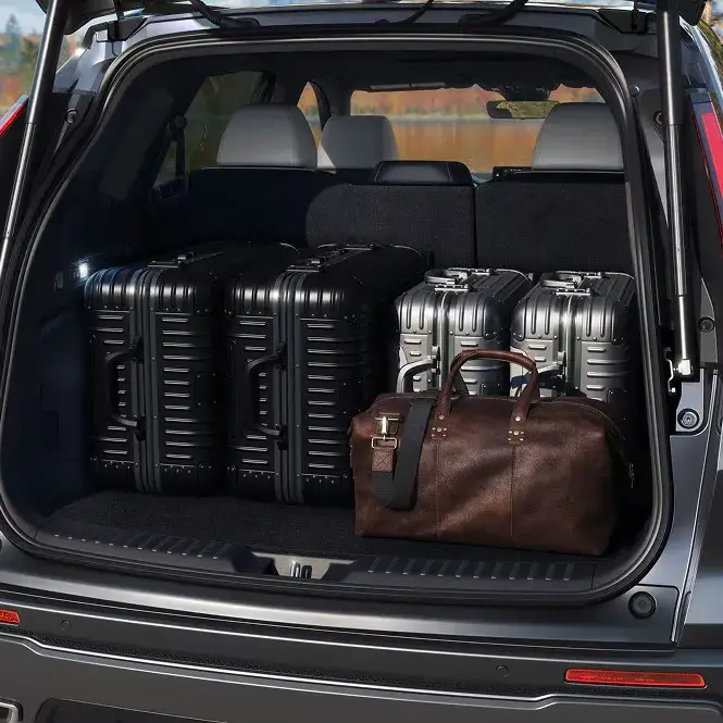 2027 Honda CR-V cargo area loaded with four suitcases and a duffel bag