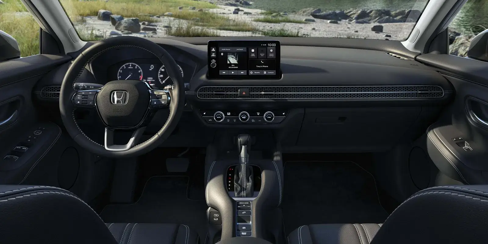 2027 Honda HR-V EX-L steering wheel and dashboard seen from the back seat, lake view