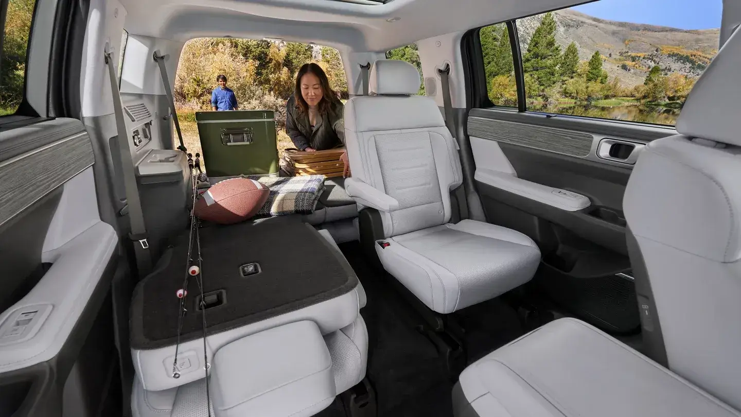 Hyundai Santa Fe gray second-row captain's chairs with the liftgate open behind