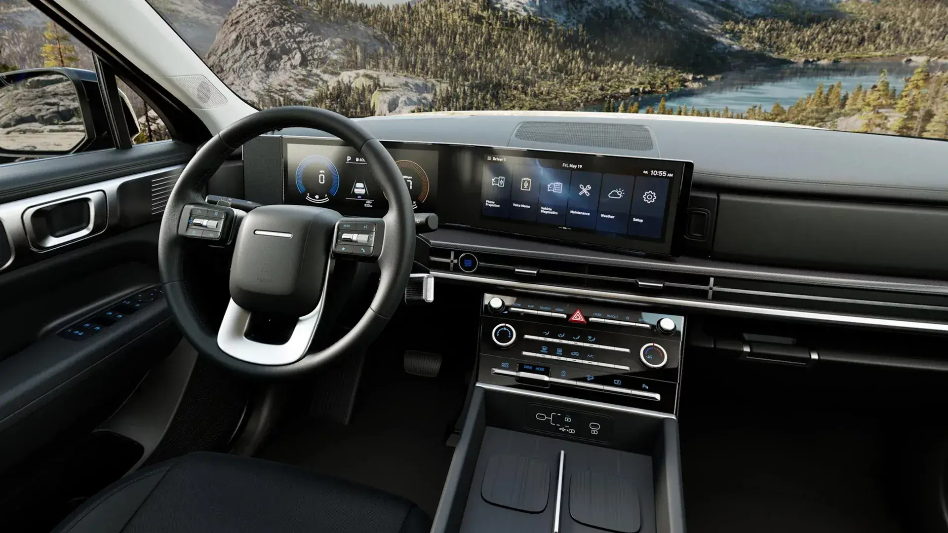 Hyundai Santa Fe dashboard, steering wheel and wide touchscreen seen from behind the driver