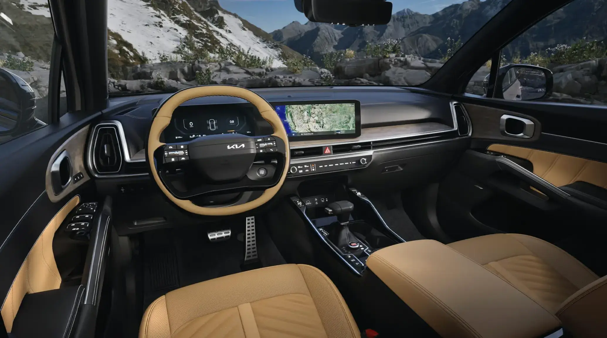 Kia Sorento tan interior with steering wheel and dual 12.3-inch screens, seen from the back seat
