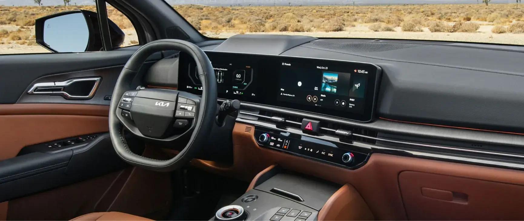 2027 Kia Sportage brown interior with steering wheel and dual 12.3-inch screens