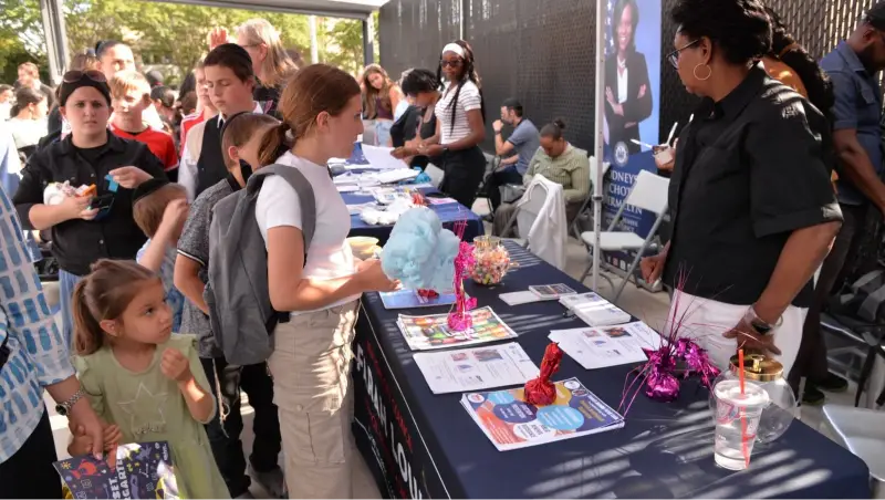 Families and volunteers at Plaza Auto Mall back-to-school community event in Brooklyn